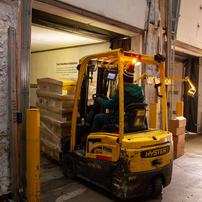 forklift loading truck at Blessings of Hope